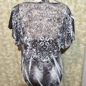 Floral flutter  sleeve  blouse.Lace detail top back. Rivets with tie in front.